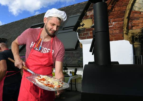 Christian Jobling is among the 5 Ways service users to help put on a pizza night at the Leeds centre.