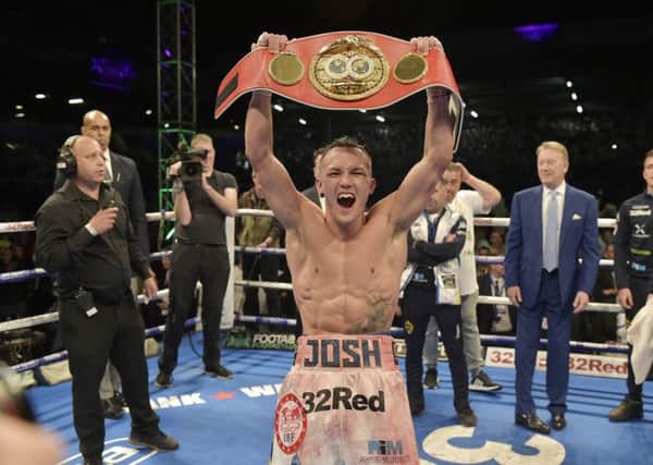 Josh Warrington on top of the world after his victory over Lee Selby in May. PIC: Steve Riding