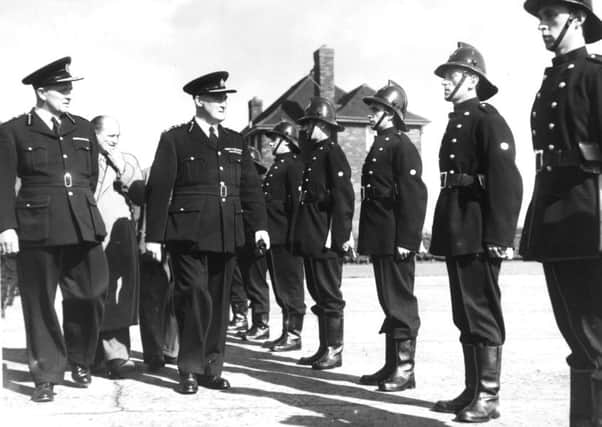 An inspection of members of the Leeds City Fire Brigade at Gipton Fire Station in 1955.