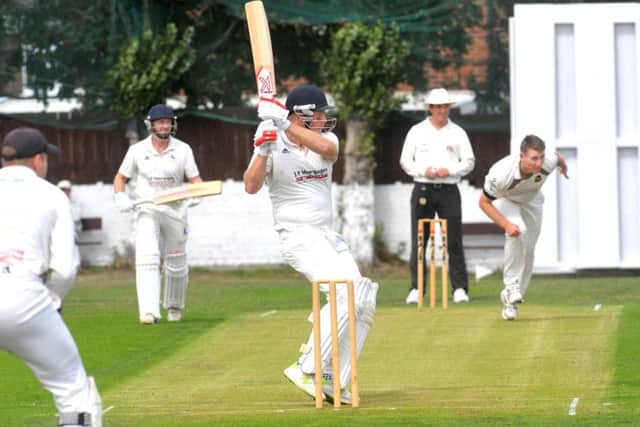 Hanging Heaton opener Nick Connolly (88) whips the ball away against Pudsey St Lawrence. PIC: Steve Riding