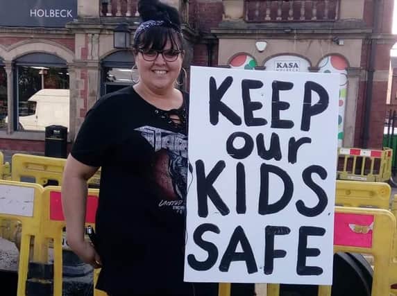 One of the protesters who took part in today's demonstration in Holbeck, Leeds.