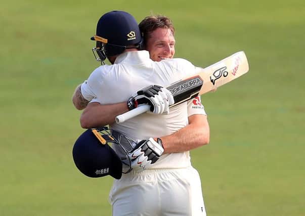 England's century-maker Jos Buttler smiles as he is congratulated by Ben Stokes (Picture: Mike Egerton/PA Wire).