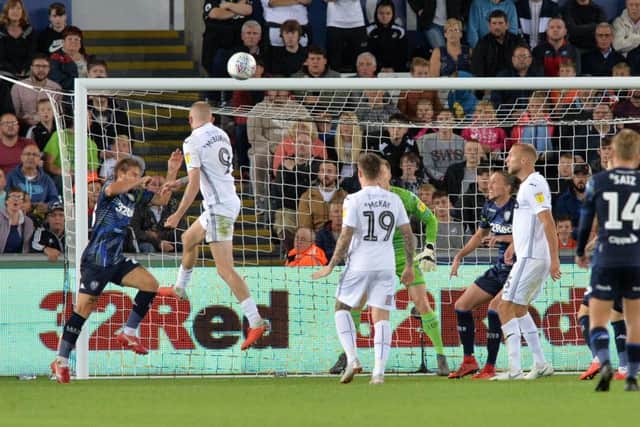 Oli McBurnie heads in his second goal against 
Leeds United.  Picture: Bruce Rollinson