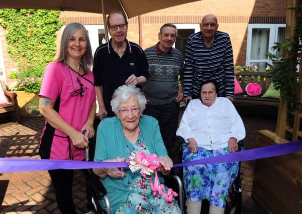 100 year old Winifred Burton Opens the new Sensory Garden at Charlton Court Nursing Home, Pudsey. Winifred is pictured with Staff and residents...27th August 2018 ..Picture by Simon Hulme