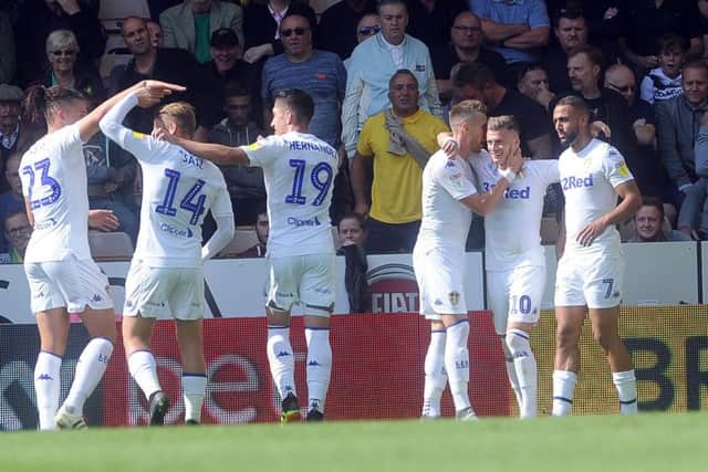 Gjanni Alioski is congratulated by team-mates after scoring at Norwich.