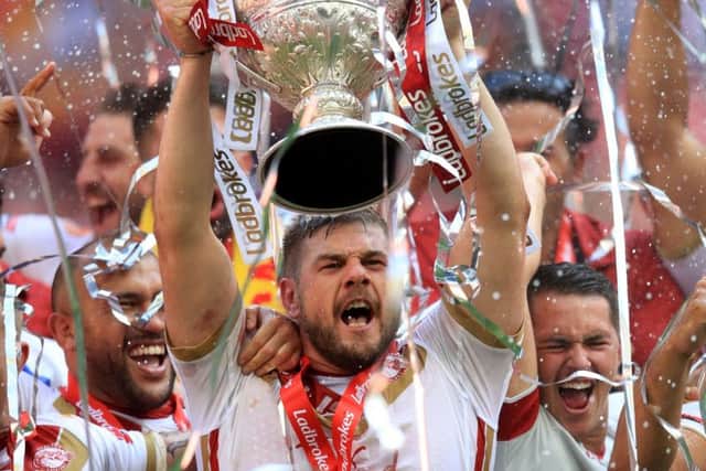 Catalans Dragons' Remi Casty lifts the Challenge Cup.