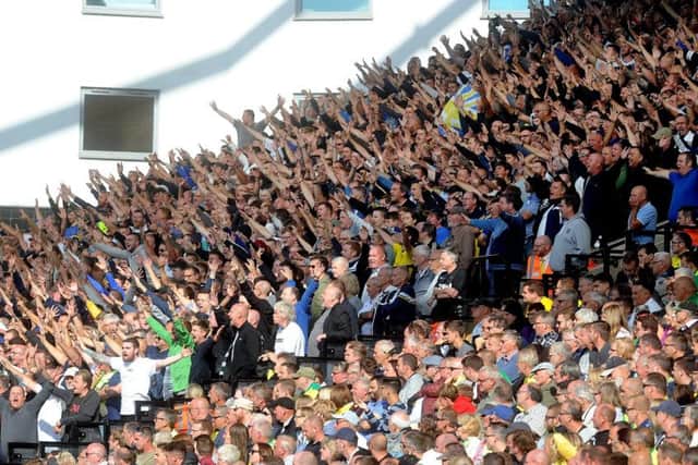 Leeds United fans celebrate their side's 3-0 victory at Norwich.