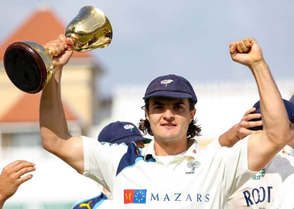 Just champion: Yorkshire's Jack Brooks celebrates with the trophy in 2014.
