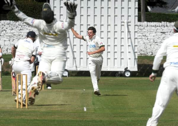 Charlie Best, of Pudsey St Lawrence, is out caught by New Farnley wicketkeeper Steve Bullen off the bowling of Andrew Brewster. PIC: Steve Riding
