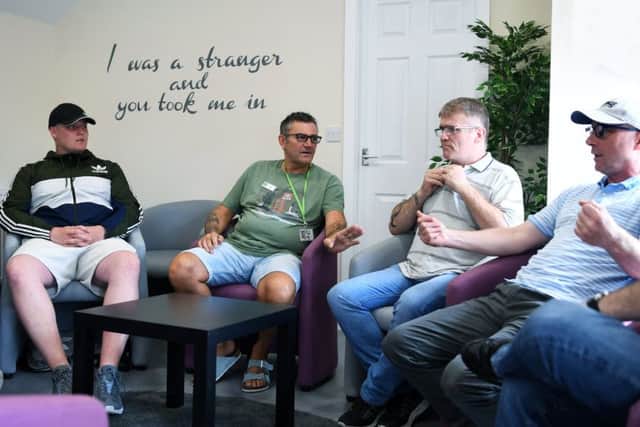 Danny, far right, takes part in a session led by therapeutic drug and alcohol worker John Davis, second from left.