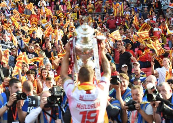 Michael McIlorum lifts the Challenge Cup at Wembley.
