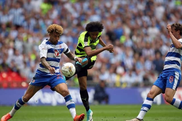 Izzy Brown gets in a shot during the 2017 Championship play-off final against Reading, the attacking midfielder proving an integral part of Huddersfield Town's promotion success. Picture: PA