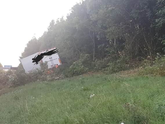 A lorry has left the A1(M) motorway and become stuck on the grass embankment. 
PIC: West Yorkshire Police RPU