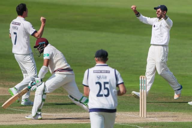 Yorkshire's Matthew Fisher celebrates with Jack Leaning and Adam Lyth after taking the wicket of Somerset's Azhar Ali. Picture: Alex Whitehead/SWpix.com