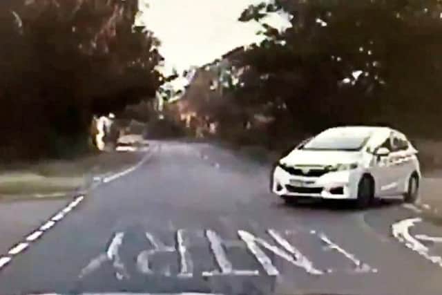 The moment the driver almost took out a police patrol car. Photo: SWNS