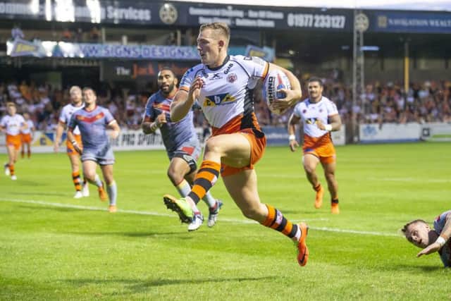 Castleford's Greg Eden evades the Catalans' defence to go on and score a try.