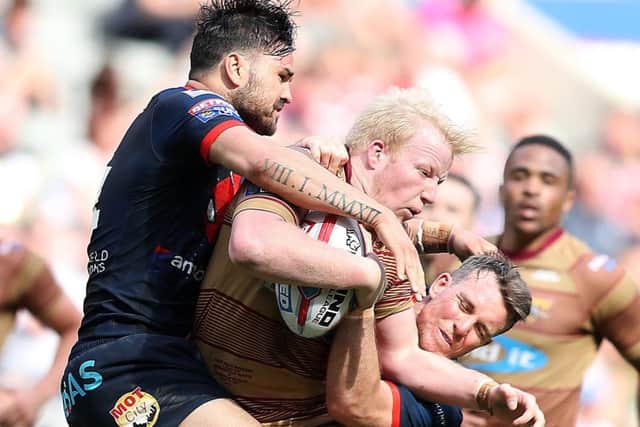 Justin Horo, left, and Wigan local Matty Ashurst, right, are in the mood to cause an upset against the Warriors. PIC: John Clifton/SWpix.com