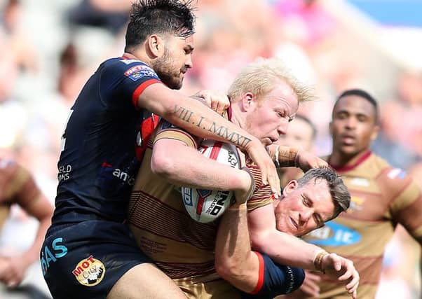 Justin Horo, left, and Wigan local Matty Ashurst, right, are in the mood to cause an upset against the Warriors. PIC: John Clifton/SWpix.com