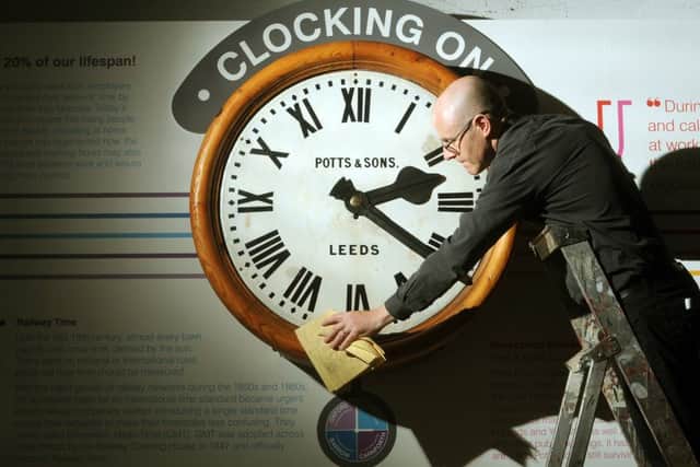 John McGoldrick with the restored clock.