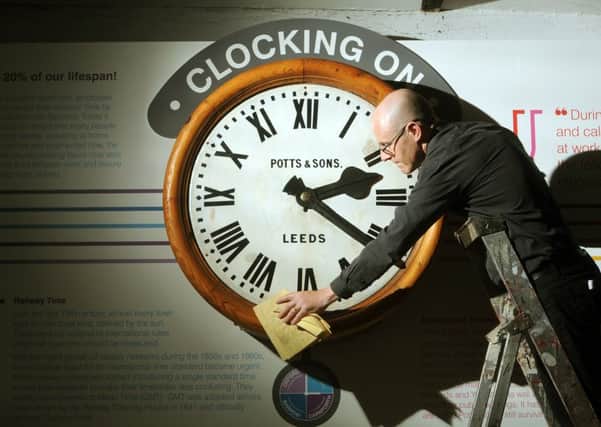 John McGoldrick with the restored clock.
