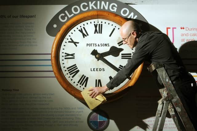 Curator John McGoldrick with the restored Potts and Sons railway clock installed at the Leeds Industrial Museum. PIC: Tony Johnson