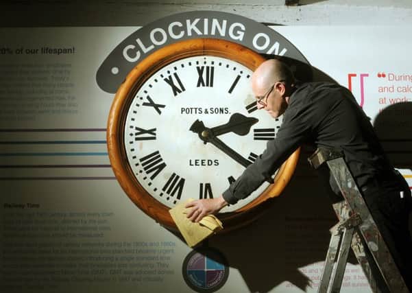 Curator John McGoldrick with the restored Potts and Sons railway clock installed at the Leeds Industrial Museum. PIC: Tony Johnson