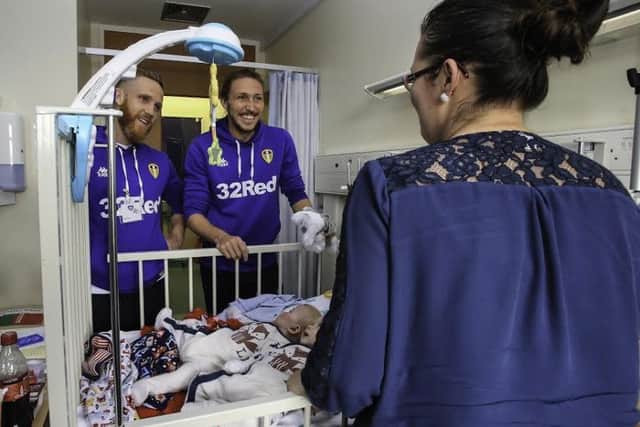 Luke Ayling and Adam Forshaw of Leeds United pictured during a visit to Leeds Congenital Heart Unit at Leeds General Infirmary.