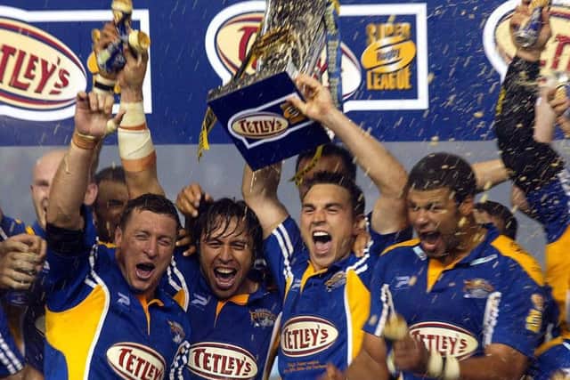 WINNERS: Leeds Rhinos' David Furner, left, Willie Poching, Kevin Sinfield and Ryan Bailey celebrate their 2004 GHrand Final win. Picture: John Clifton/SWpix.com