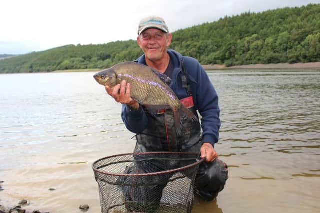 Stunning fish from stunning surroundings, Steve Edson with one of the bream that helped him clinch the first-ever Lindley Wood Festival.