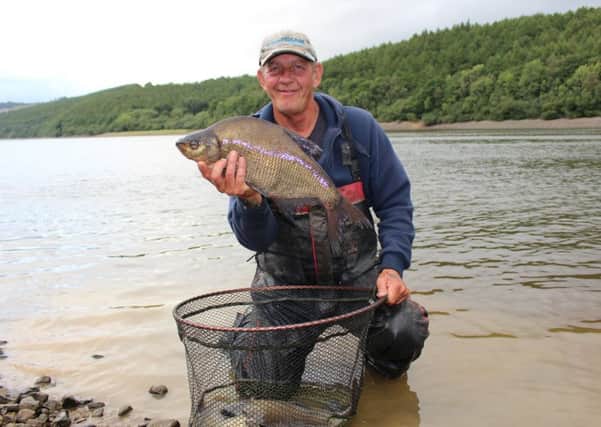 Stunning fish from stunning surroundings, Steve Edson with one of the bream that helped him clinch the first-ever Lindley Wood Festival.