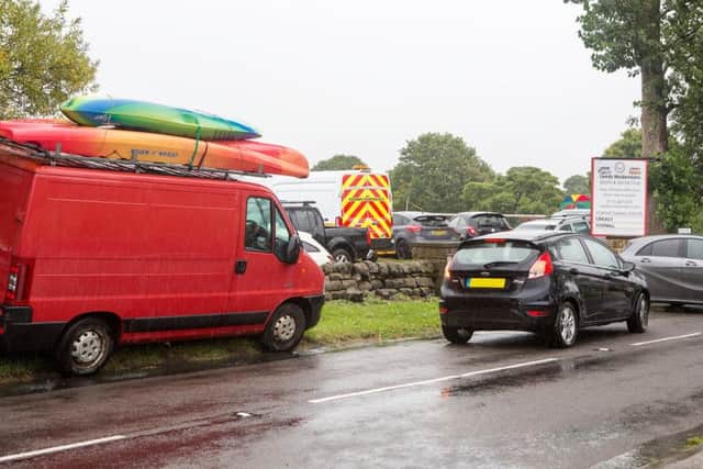 Canoe and umbrella weather at Leeds Modernians. PIC: John Heald