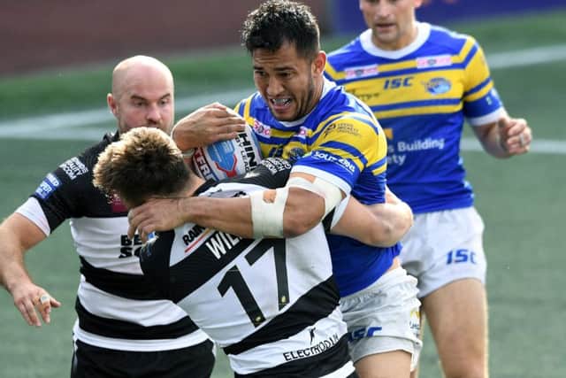 Leeds Rhinos' Nathaniel Peteru is tackled by Widnes' Sam Wilde.