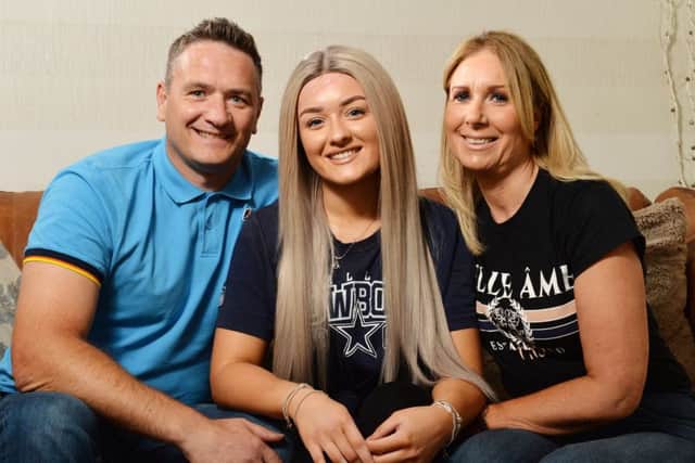 Robyn Hoban,  pictured with her parents Paul and Amanda.