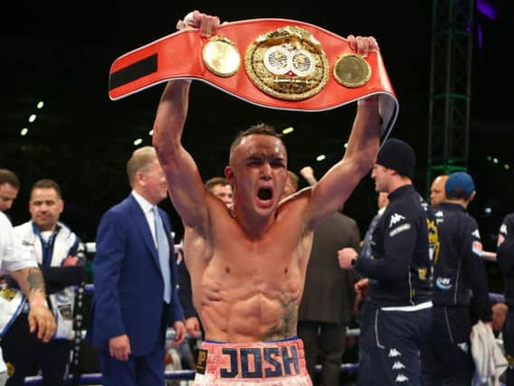 Josh Warrington celebrates at Elland Road after defeating Lee Selby to claim the IBF World Featherweight title.