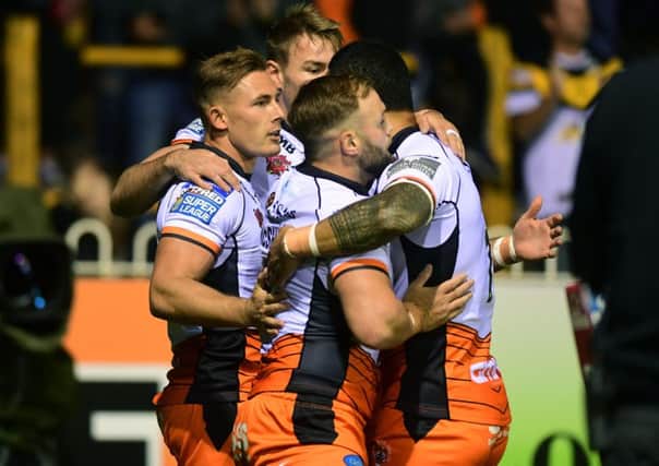 Tigers' Greg Eden celebrates his early try.