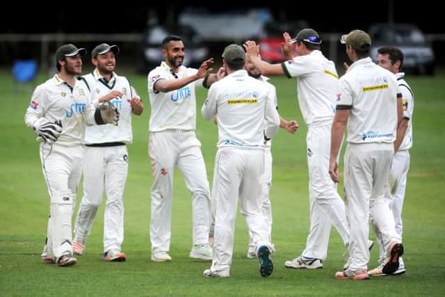 Ajmal Shahzad celebrates taking a wicket for New Farnley.