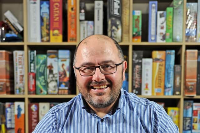 4 September 2018......     Nabil Homsi (owner of The Travelling Man) says the board game universe has never been more popular as people abandon consoles and go back to good old fashioned RPGs and card games... he runs weekly gaming nights at his comic book/RPG shop on Central Road in Leeds. Picture Tony Johnson.