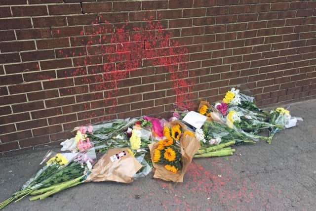 Flowers left at the scene where a homeless man was sprayed with paint in Normanby, Middlesbrough. PIC: PA