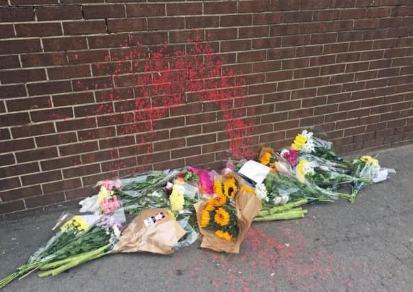 Flowers left at the scene where a homeless man was sprayed with paint in Normanby, Middlesbrough. PIC: PA