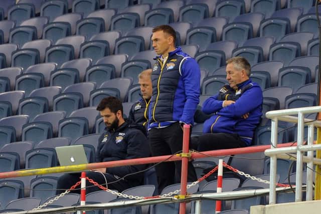 Kevin Sinfield and James Lowes watch from the South Stand.