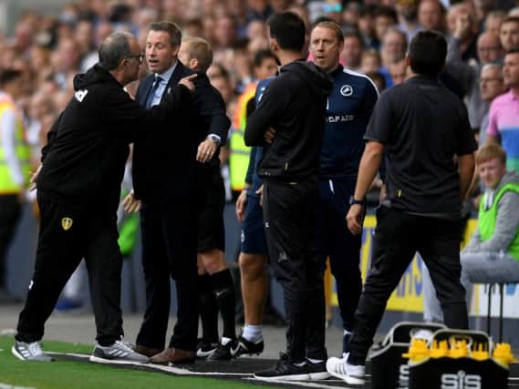 Leeds United head coach Marcelo Bielsa exchanges words with the Millwall bench.