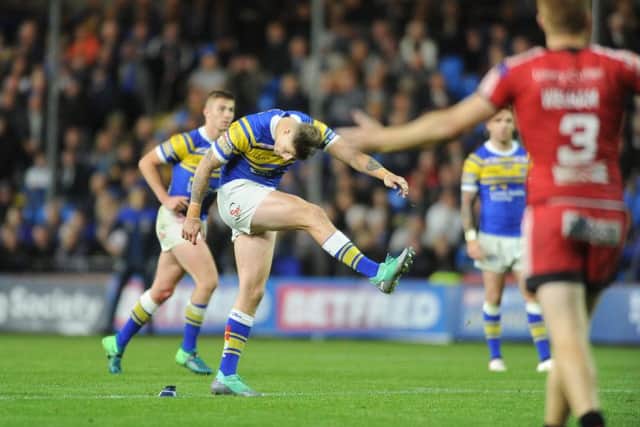 Liam Sutcliffe kicks the winning penalty goal in the final seconds against Salford.