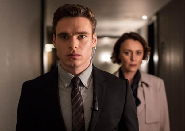 GUARDED RESPONSE: Richard Madden and Keeley Hawes in a scene from the hit TV series Bodyguard.