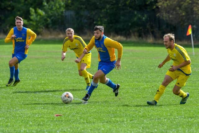 Hope Inn Whites' Charlie Stephen breaks up-field against Seacroft WMC. PIC: James Hardisty