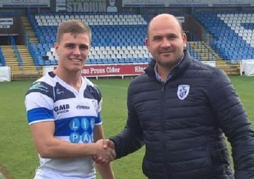 Leeds Rhinos Academy product Kiedan Hartley (pictured with Rovers' general manager Davide Longo) has signed for Featherstone for next season. PIC: Featherstone Rovers RLFC