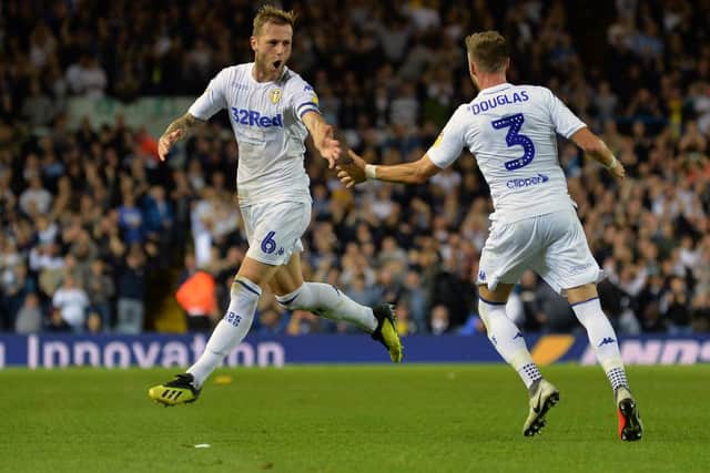 Liam Cooper celebrates Leeds United's opener against Preston.