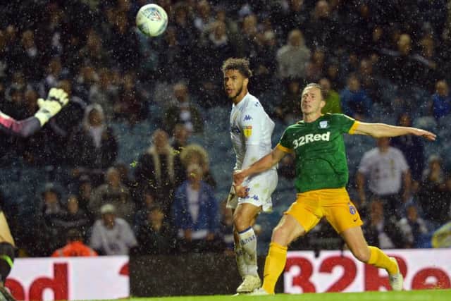 Tyler Roberts lobs the ball over Declan Rudd to score Leeds' second goal.