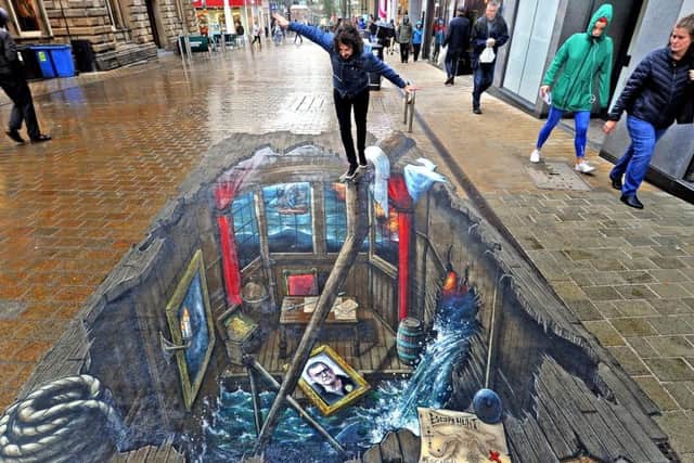 21 September  2018......     Andrew Boocock gets up close with Escape Hunt Leeds 3D masterpiece by world-famous street artists Joe & Max On Albion Street The visual is of Blackbeard's cabin featuring a portrait of Leeds United's manager Marcelo Bielsa to launch the new Blackbeard's Treasure escape room opening tomorrow in the city.  Picture Tony Johnson.