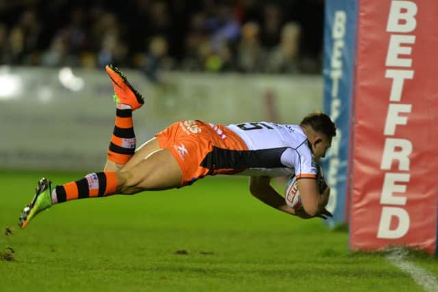 Greg Eden scores his third try.