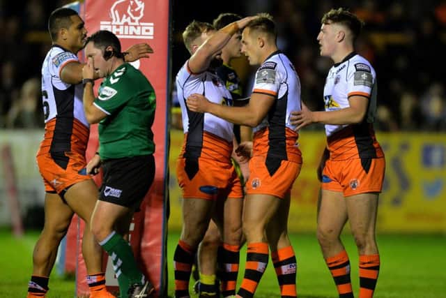Greg Eden celebrates his third try.